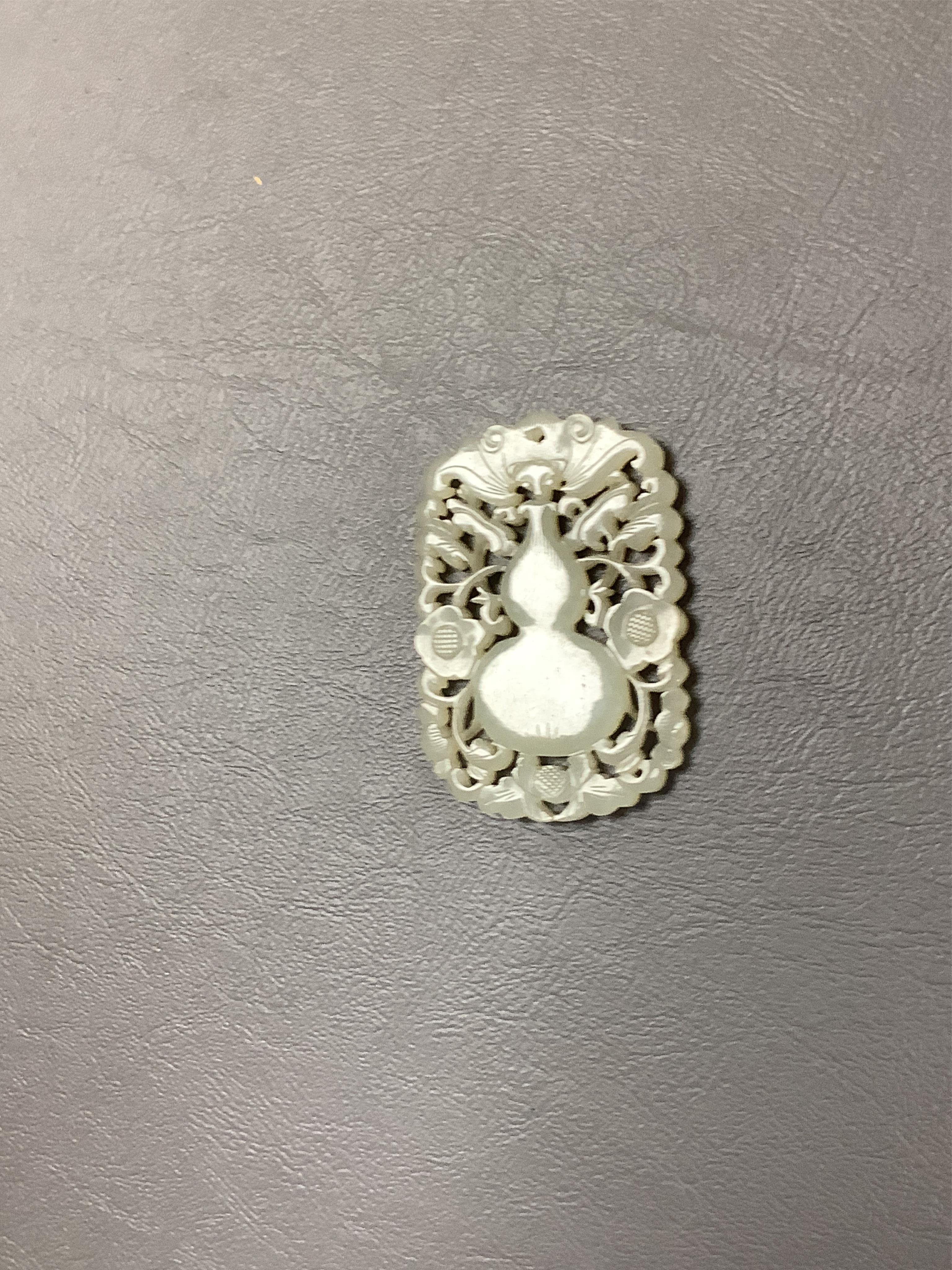 A carved jade/nephrite 19th century carving, 6cm long. Condition - good